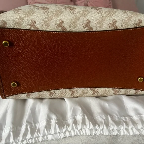 Coach Brown and Cream Tote Bag that is the sun that is casting spots on the bag - Picture 7 of 7